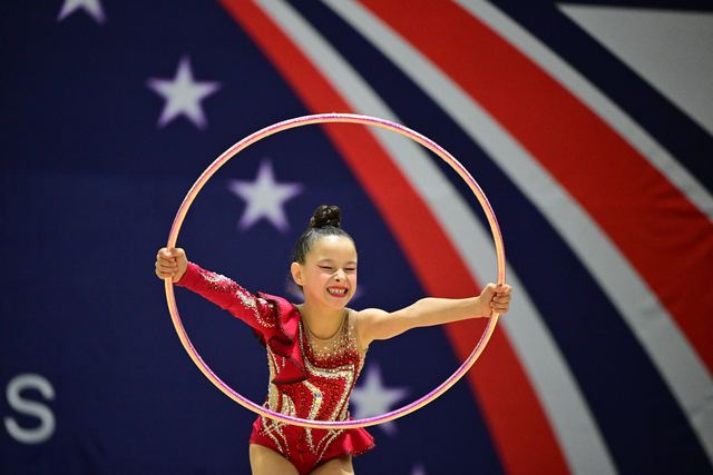 An SRG Academy gymnast performing a hoop routine at a USA Gymnastics competition