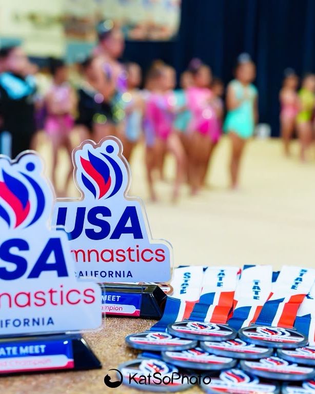 The awards table at a USA Gymnastics California state meet
