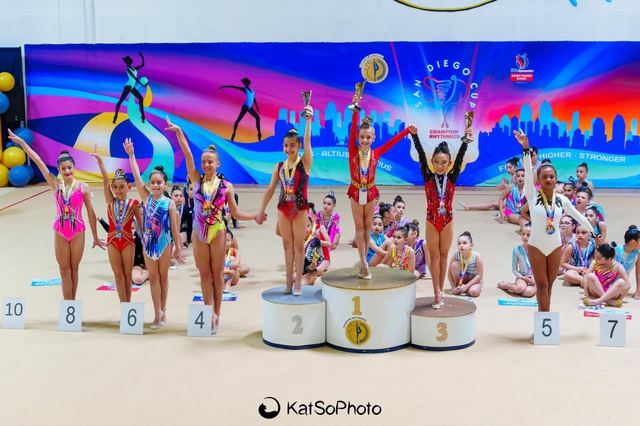 SRG Academy gymnasts wearing their medals after a meet